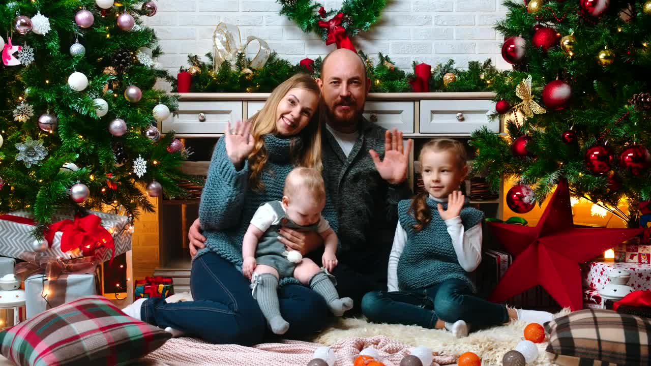 Stock Video Happy Family Greeting At The Camera On Christmas Animated Wallpaper