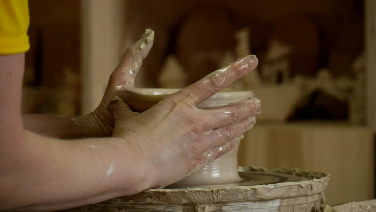 Stock Video Hands Working On Raw Ceramic Animated Wallpaper