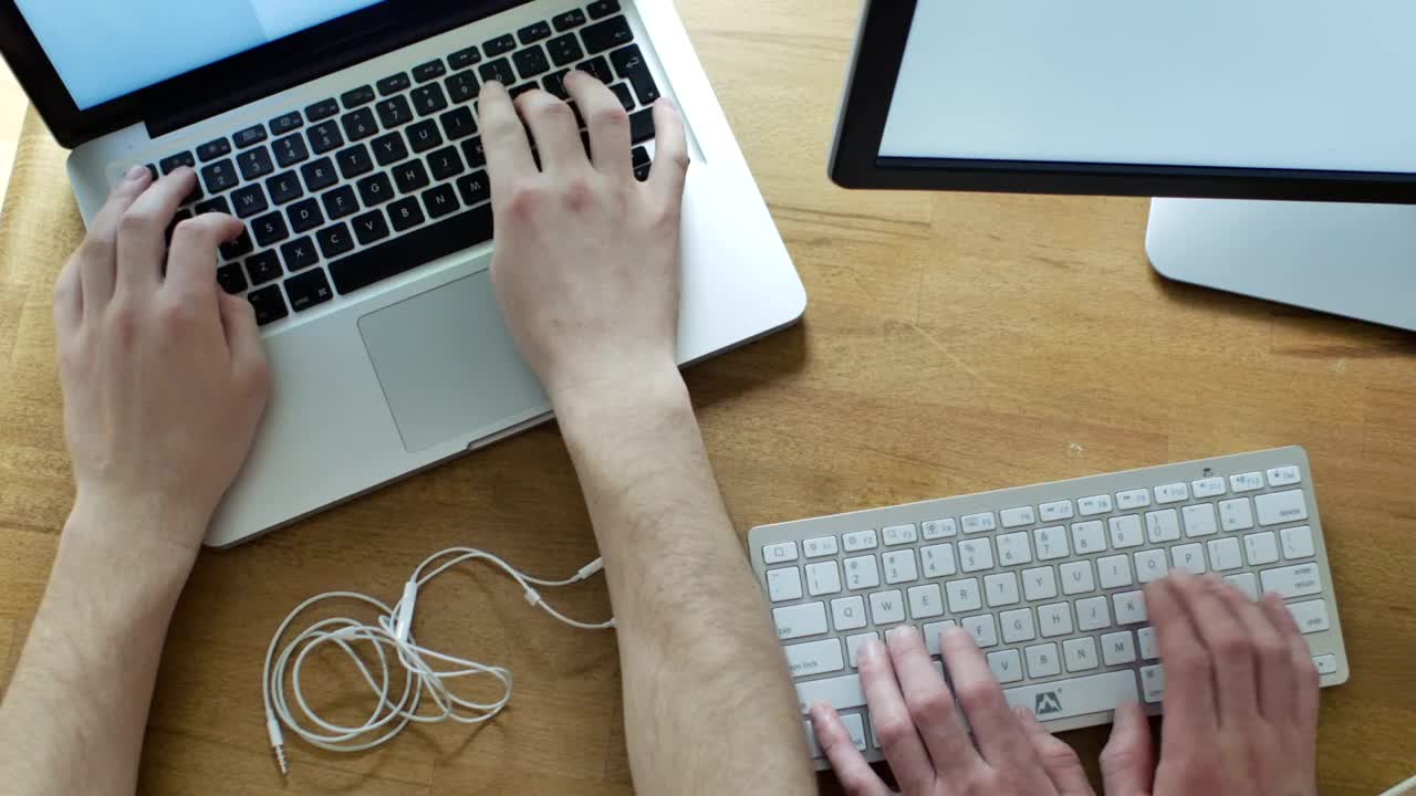 Stock Video Hands Working On Different Keyboards On A Desk Animated Wallpaper