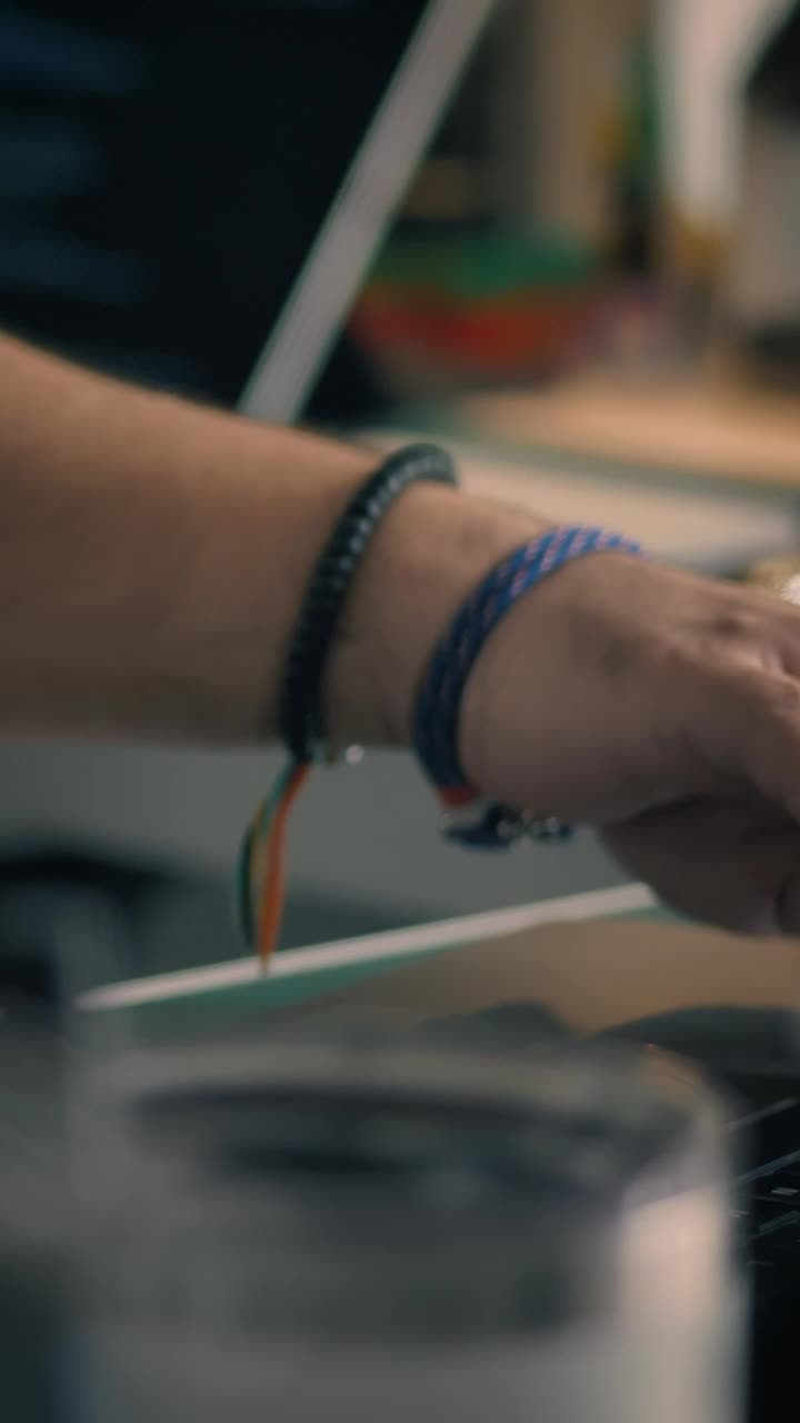 Stock Video Hands Of An Engineer Programming On A Pair Of Computers Animated Wallpaper