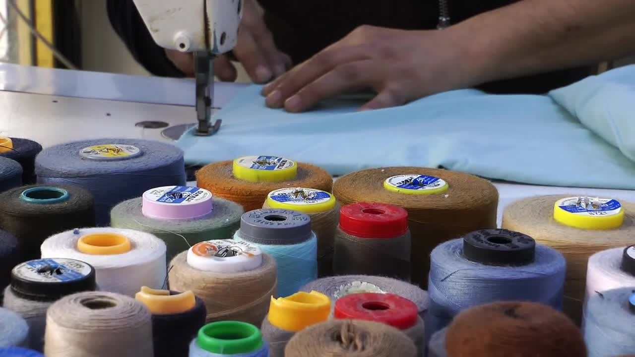 Stock Video Hands Of A Tailor Working Animated Wallpaper