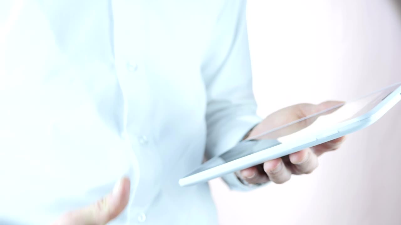 Stock Video Man Holding A Tablet Makes A Thumb Up Sign Animated Wallpaper