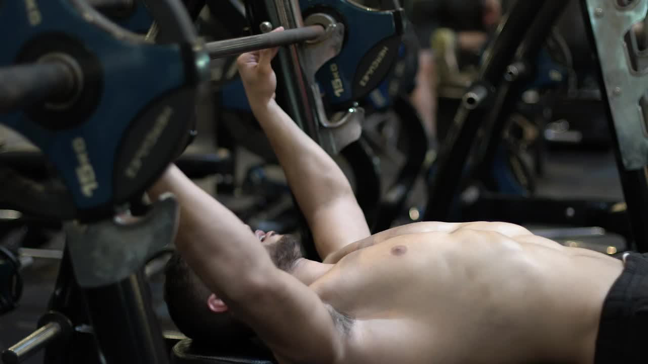 Stock Video Man Exercising With A Big Dumbbell Animated Wallpaper