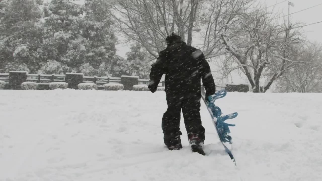 Stock Video Man Dragging His Snowboard Animated Wallpaper