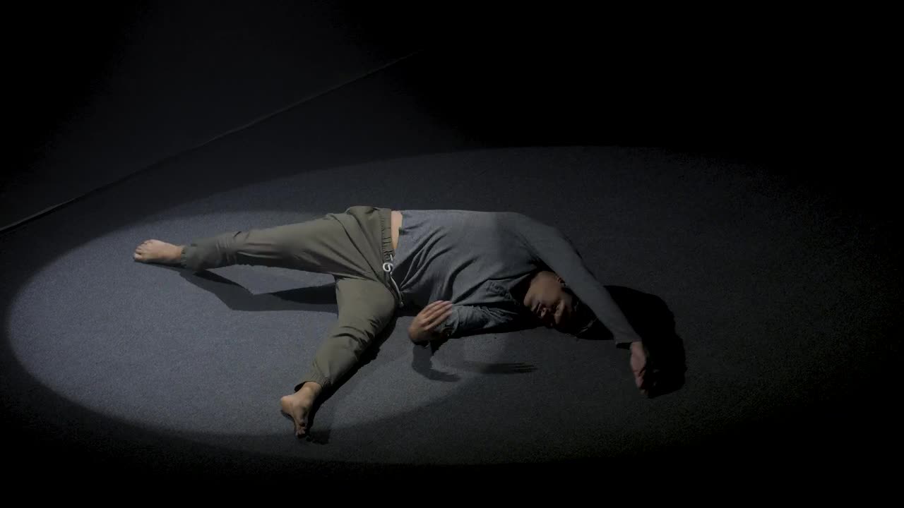 Stock Video Man Doing Floor Performance In The Dark Animated Wallpaper