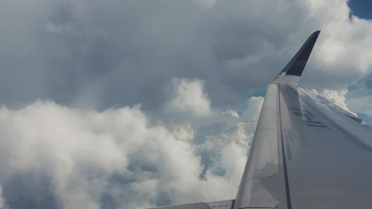 Stock Video Looking At The Clouds From A Plane Window Animated Wallpaper