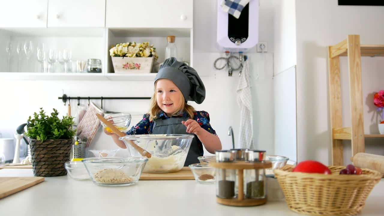 Stock Video Little Girl Stirring A Cookie Mix Animated Wallpaper