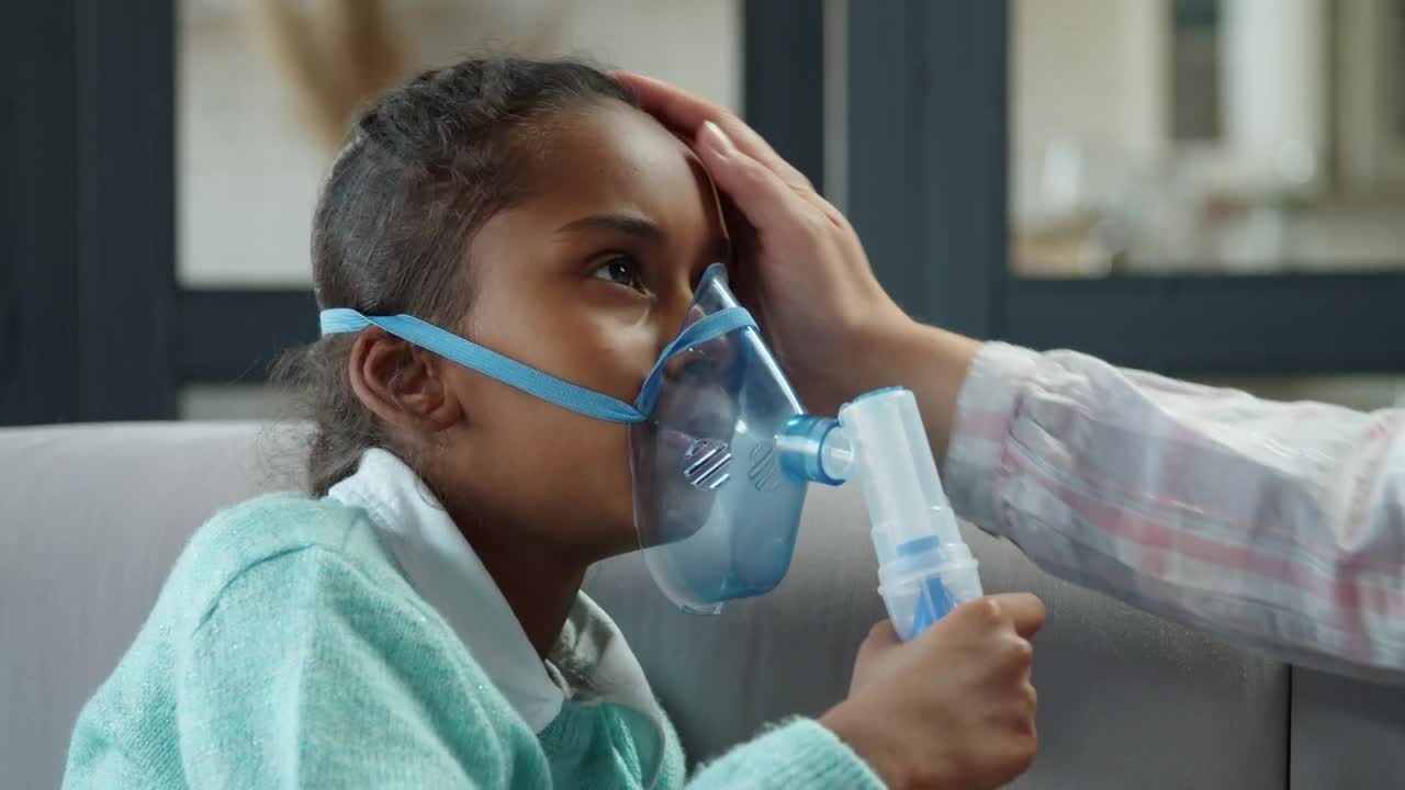 Stock Video Little Girl Breathing From A Nebulizer Animated Wallpaper
