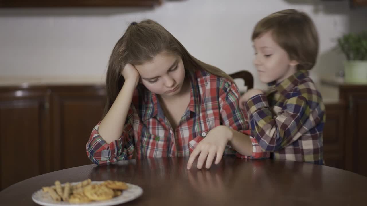 Stock Video Little Brother Whispers A Secret To His Sister Animated Wallpaper