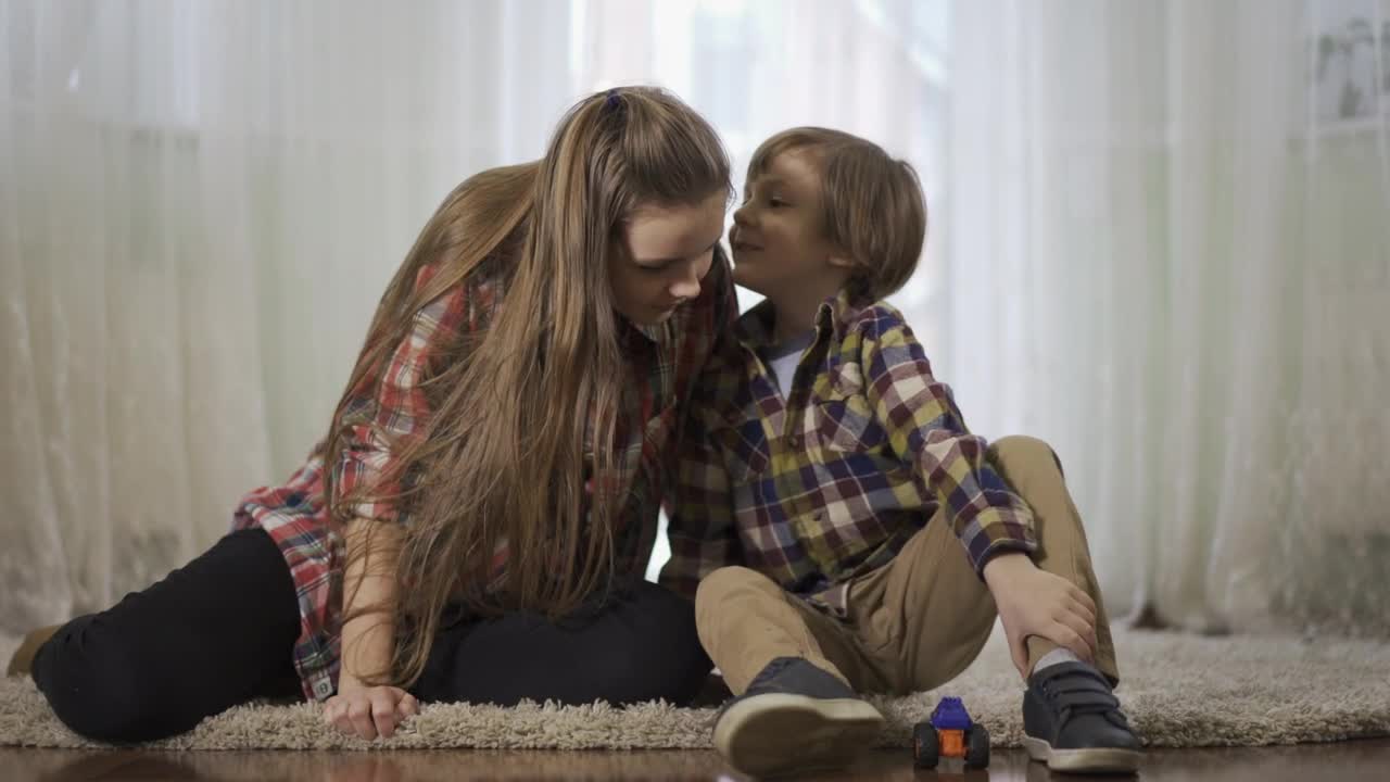 Stock Video Little Boy Whispers Secret In Sisters Ear Animated Wallpaper