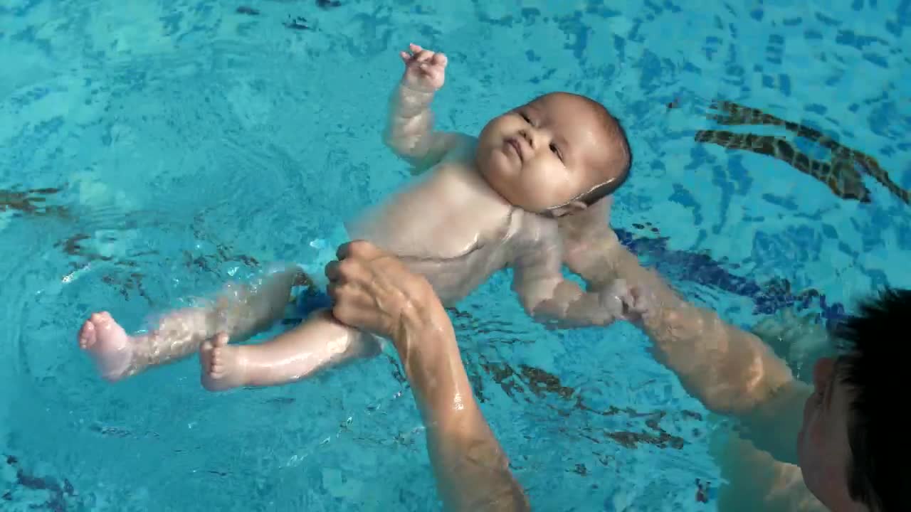 Stock Video Little Baby Learning To Float In The Pool Water Animated Wallpaper