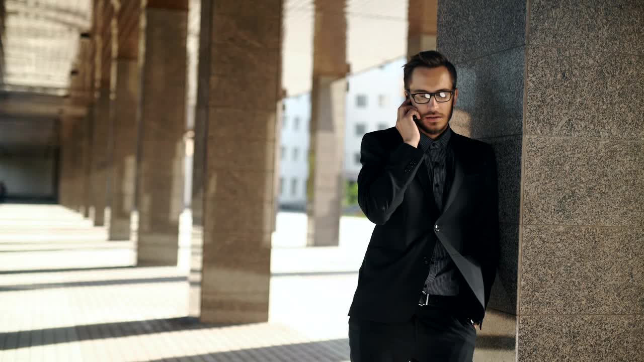 Stock Video Lawyer Talks On Phone Outside Courthouse Animated Wallpaper
