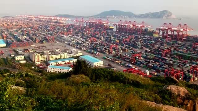Stock Video Large Warehouses Near A Coastline Aerial Shot Smal Animated Wallpaper