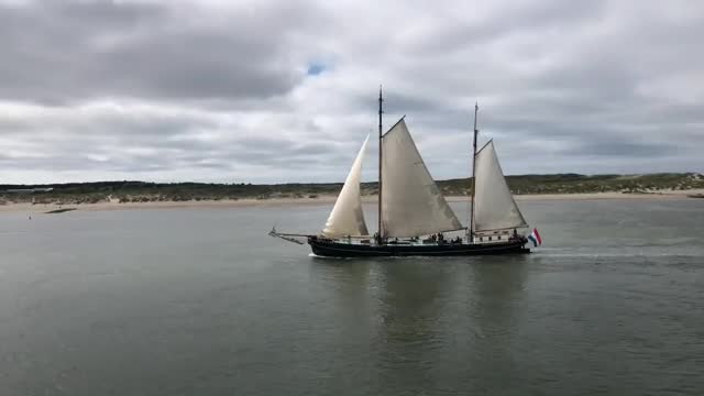 Stock Video Large Boat Sailing By An Island Smal Animated Wallpaper