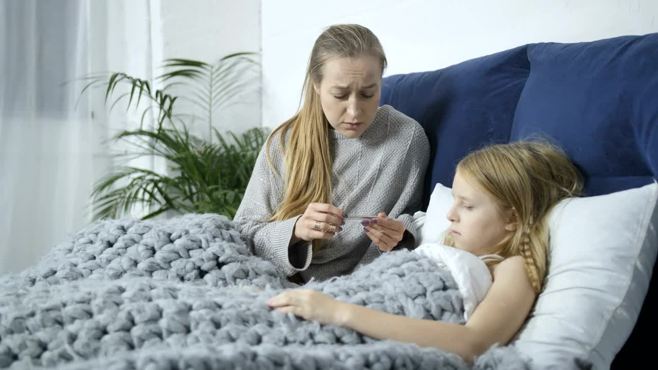 Stock Video Mother Using A Thermomete Animated Wallpaper