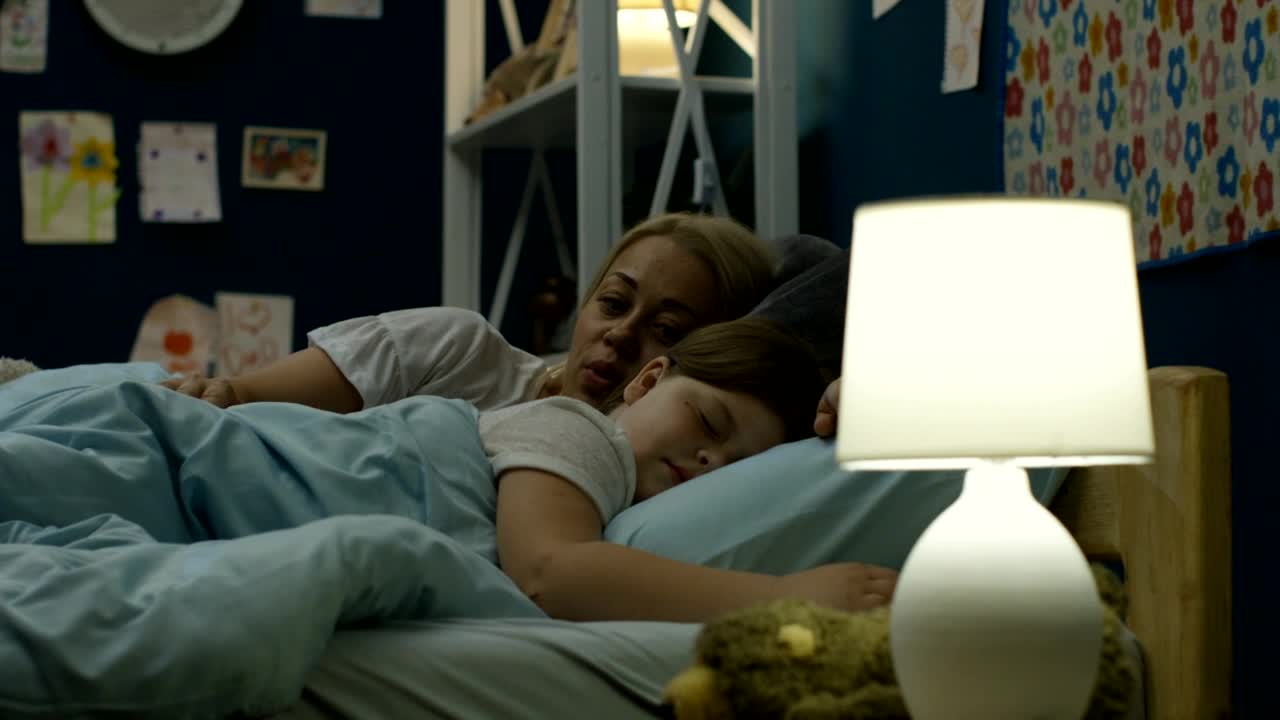 Stock Video Mother Putting His Daughter To Slee Animated Wallpaper