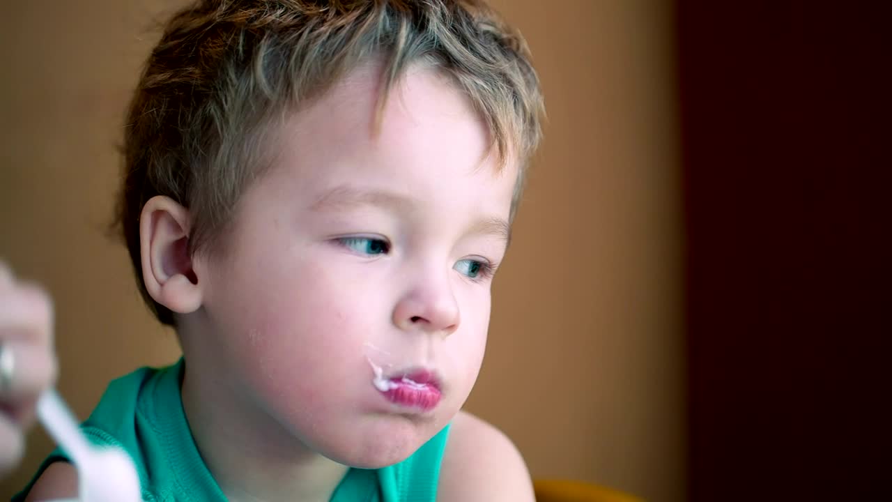 Stock Video Mother Feeding Her Child With A Spoo Animated Wallpaper