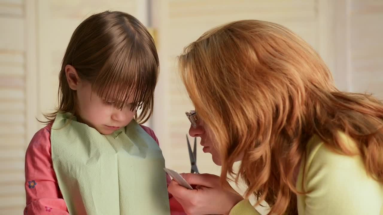 Stock Video Mother Cutting Her Daughters Hai Animated Wallpaper