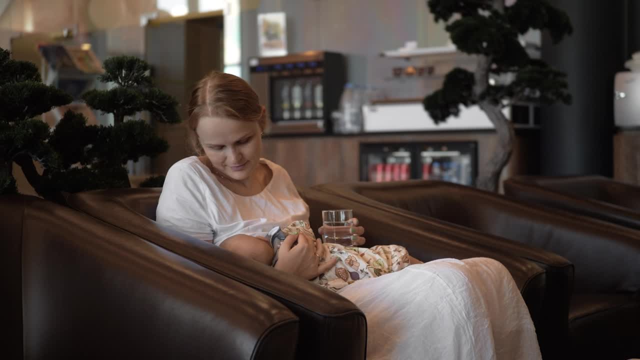 Stock Video Mother Breastfeeding Her Baby In A Hote Animated Wallpaper