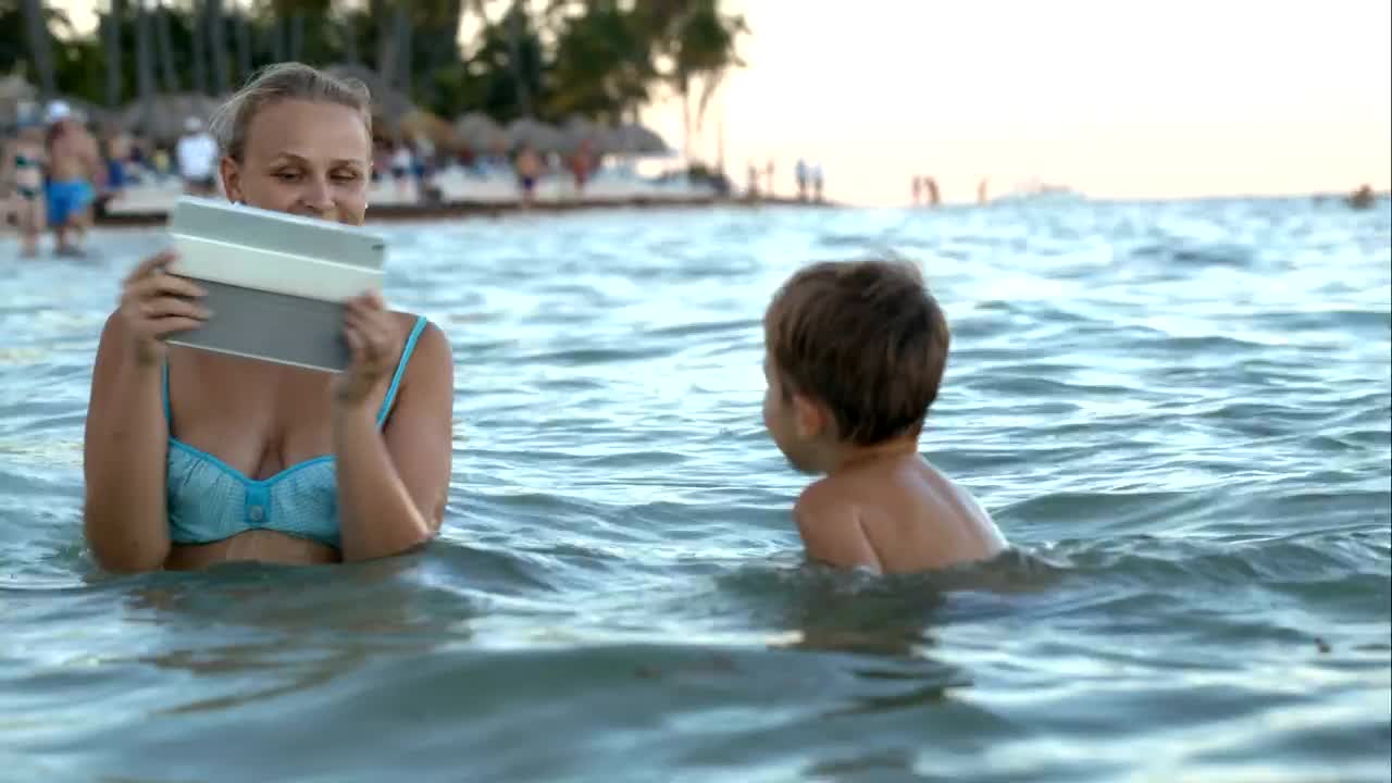Stock Video Mother And Son Taking Photos In The Se Animated Wallpaper