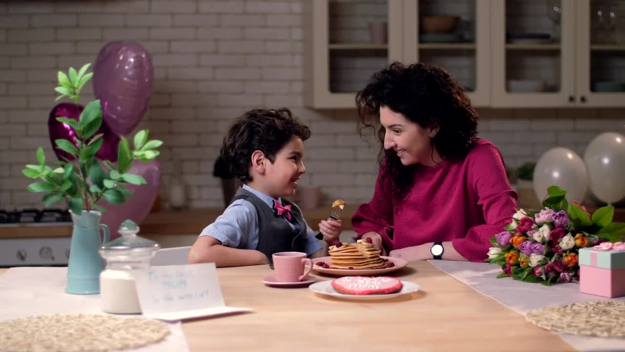 Stock Video Mother And Son Sharing Pancake Animated Wallpaper