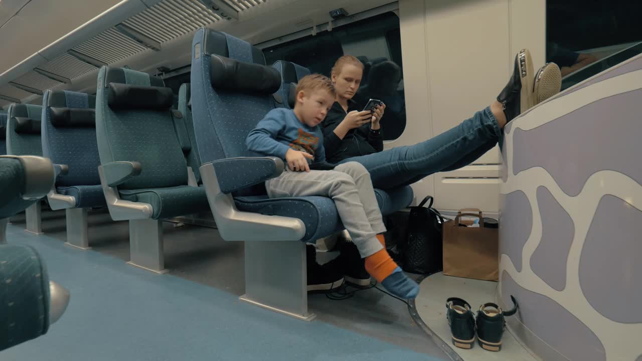 Stock Video Mother And Child On An Empty Trai Animated Wallpaper