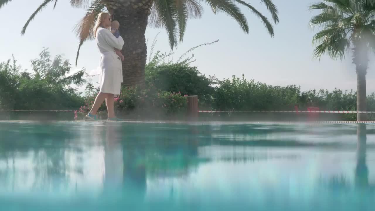 Stock Video Mother And Baby Walking By A Poo Animated Wallpaper