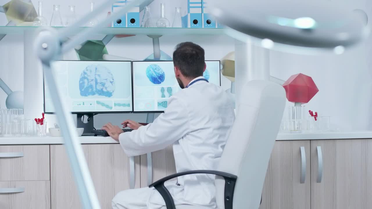 Stock Video Medical Scientist Works On Brain Models In La Animated Wallpaper