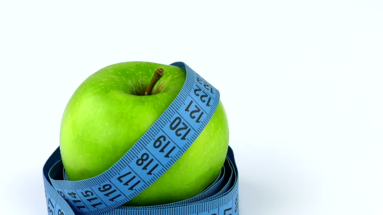 Stock Video Measuring Tape Around An Appl Animated Wallpaper