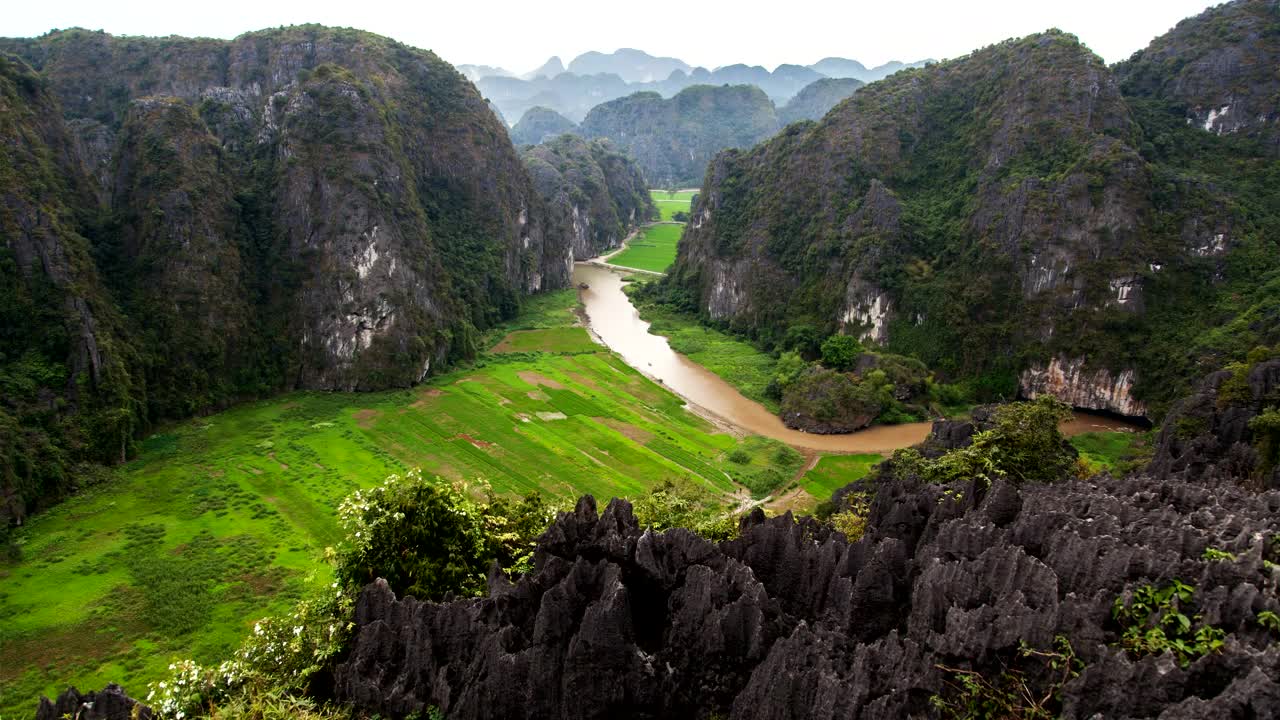 Stock Video Meadow Surrounded By Mountains With A Strea Animated Wallpaper