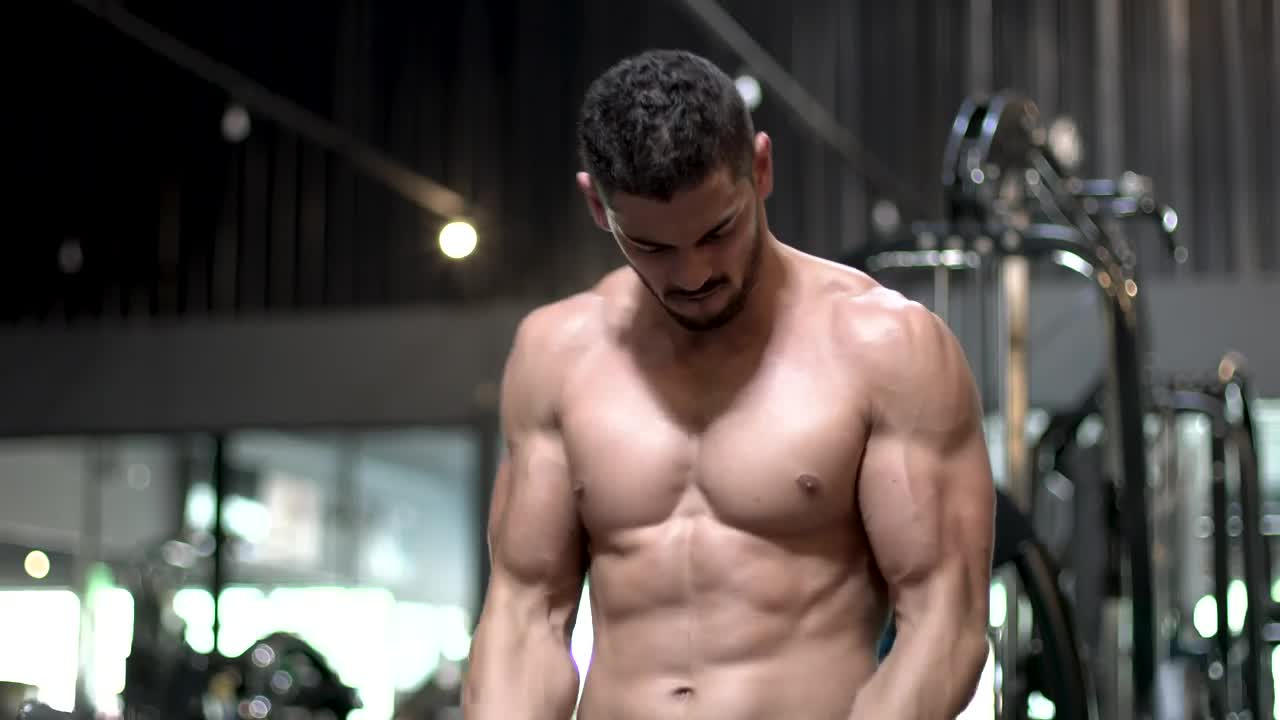 Stock Video Man Working Out With A Dumbbell In The Gy Animated Wallpaper