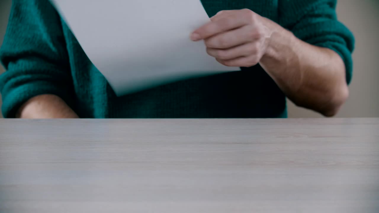 Stock Video Man With Pen And Paper On The Des Animated Wallpaper