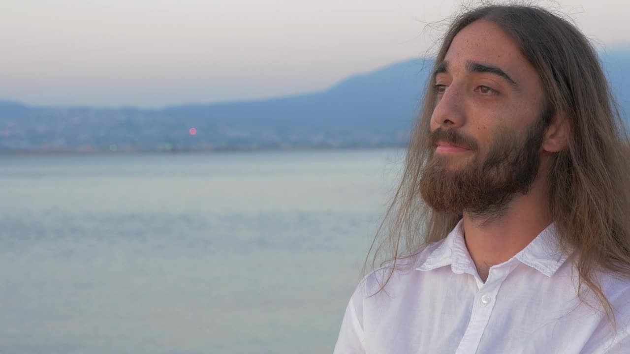 Stock Video Man With Long Hair And A Beard Looking Awa Animated Wallpaper