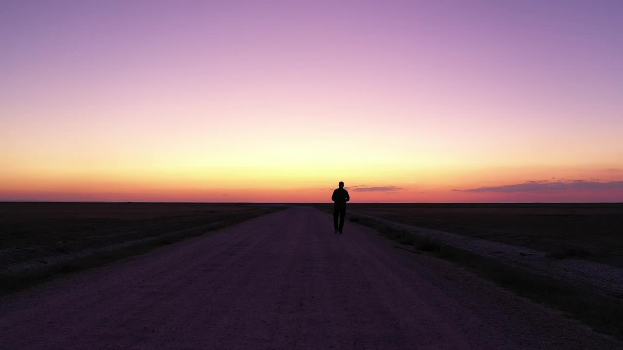 Stock Video Man Walking Down An Empty Roa Animated Wallpaper