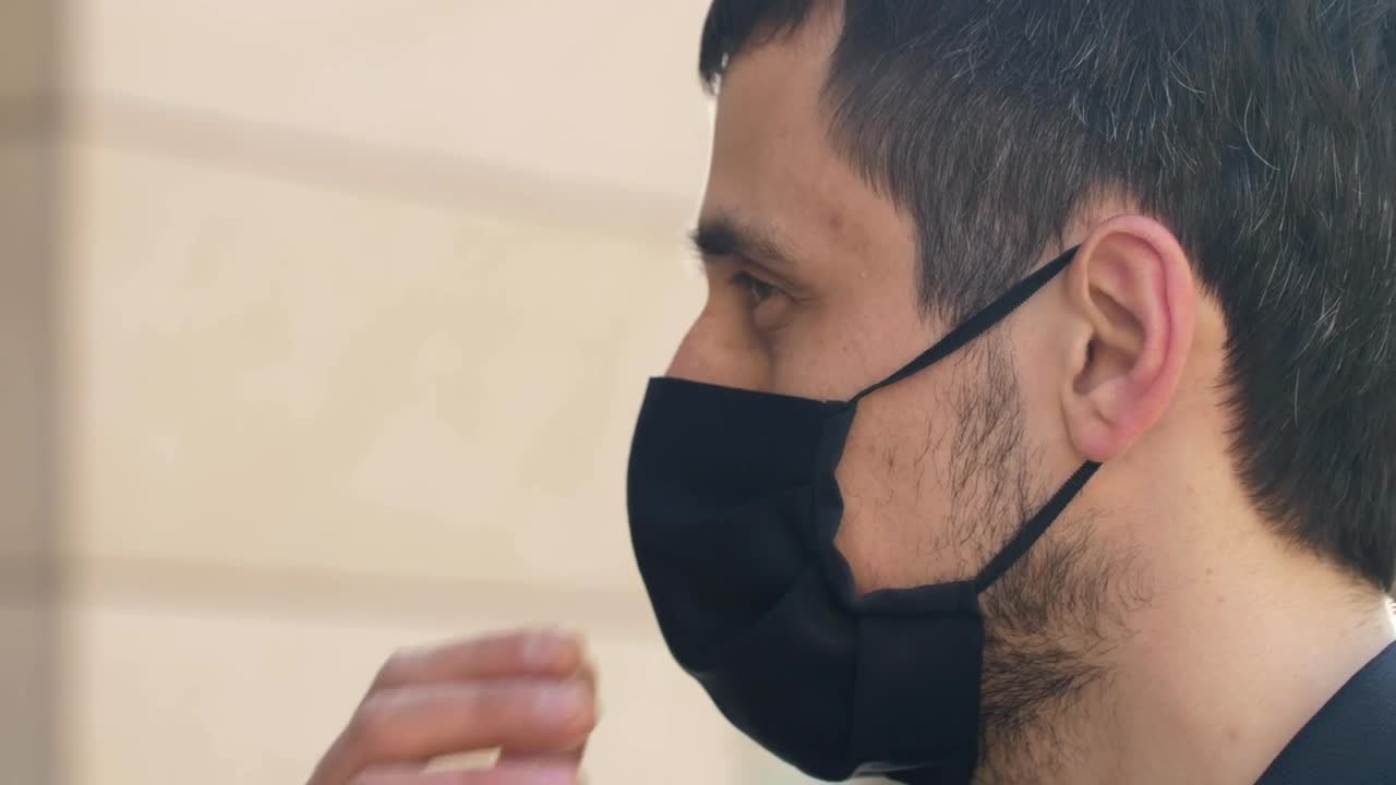 Stock Video Man Takes Off His Mask And Breathes Fresh Ai Animated Wallpaper