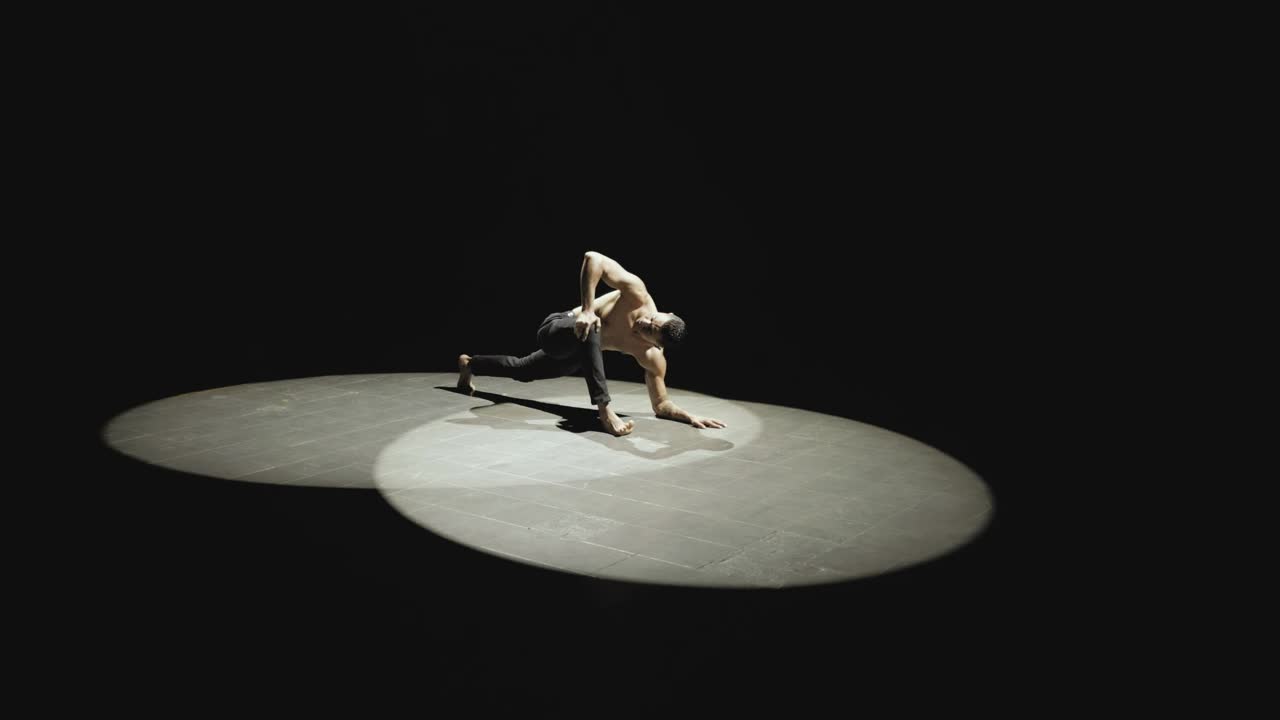 Stock Video Man Stretches In The Spotligh Animated Wallpaper