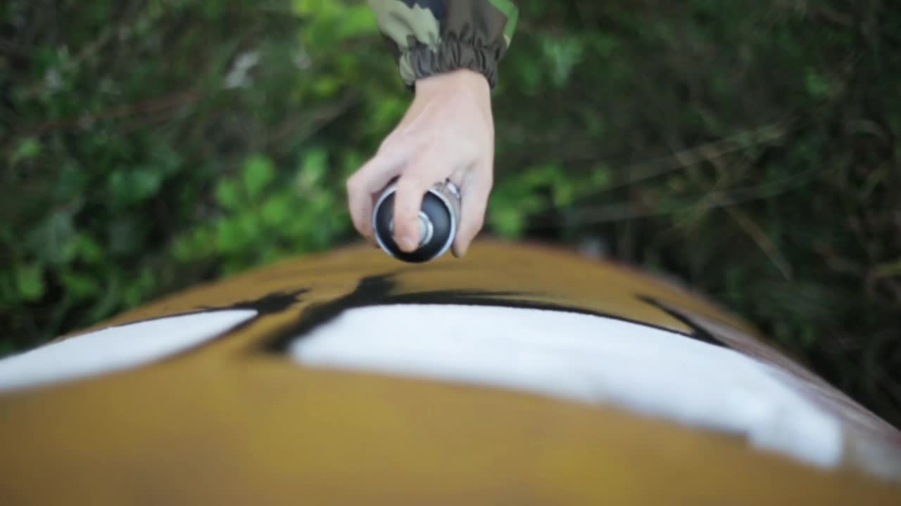Stock Video Man Spraying Graffiti On A Wal Animated Wallpaper