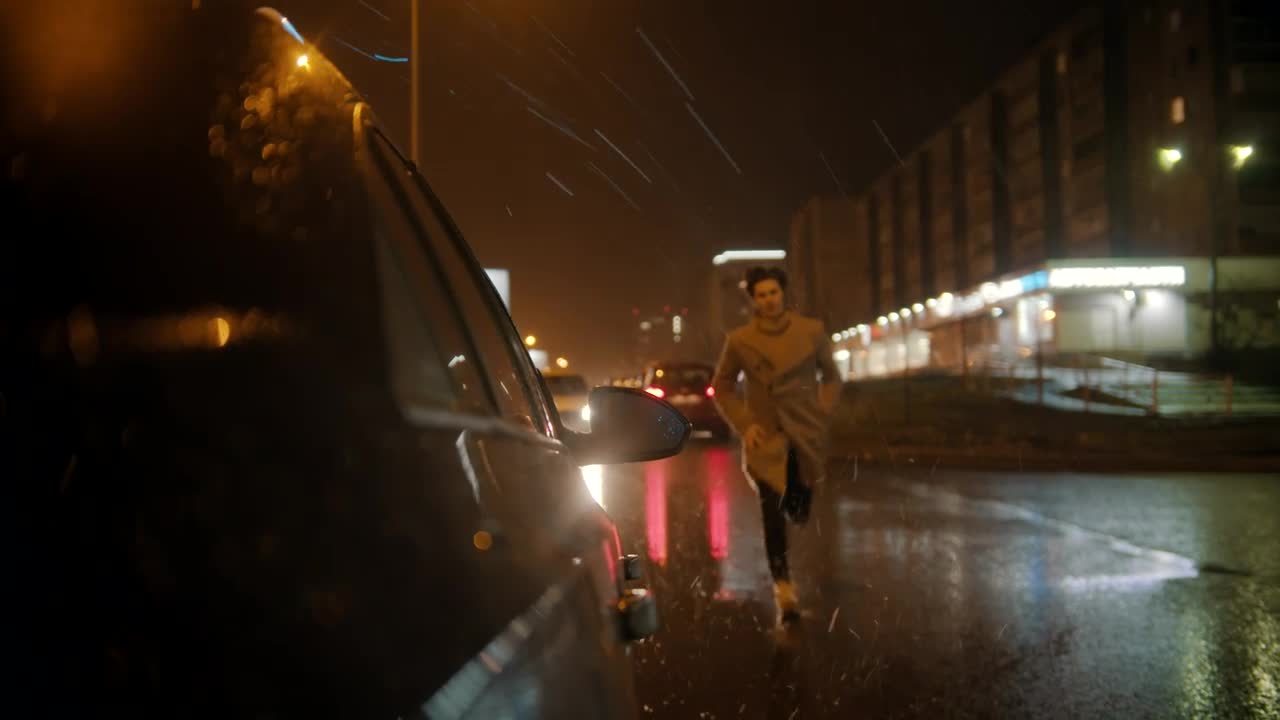 Stock Video Man Runs To Get In His Car On A Rain Animated Wallpaper