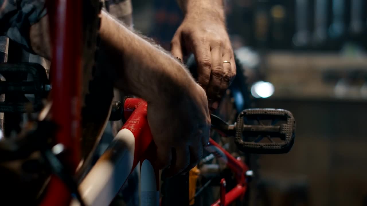 Stock Video Man Repairing A Bicycl Animated Wallpaper