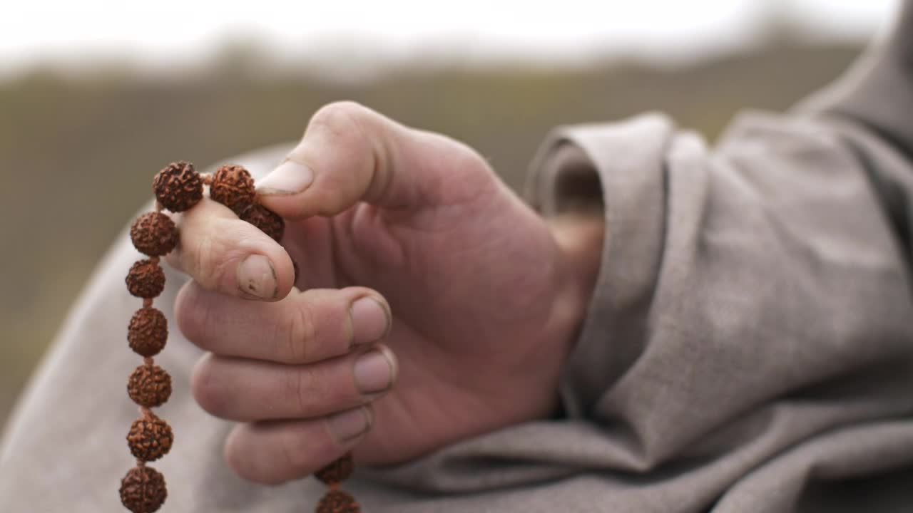 Stock Video Man Praying With A Rosary Close Up Of Hand Animated Wallpaper
