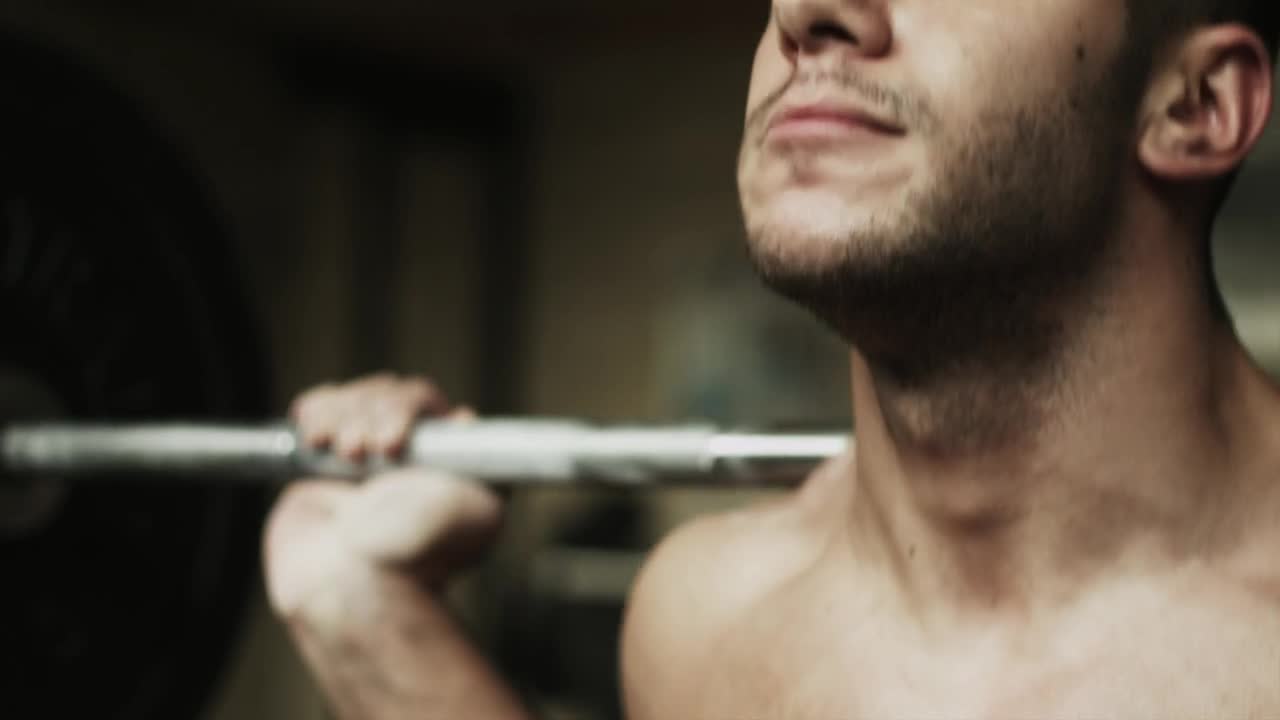 Stock Video Man Lifting Weights At The Gy Animated Wallpaper