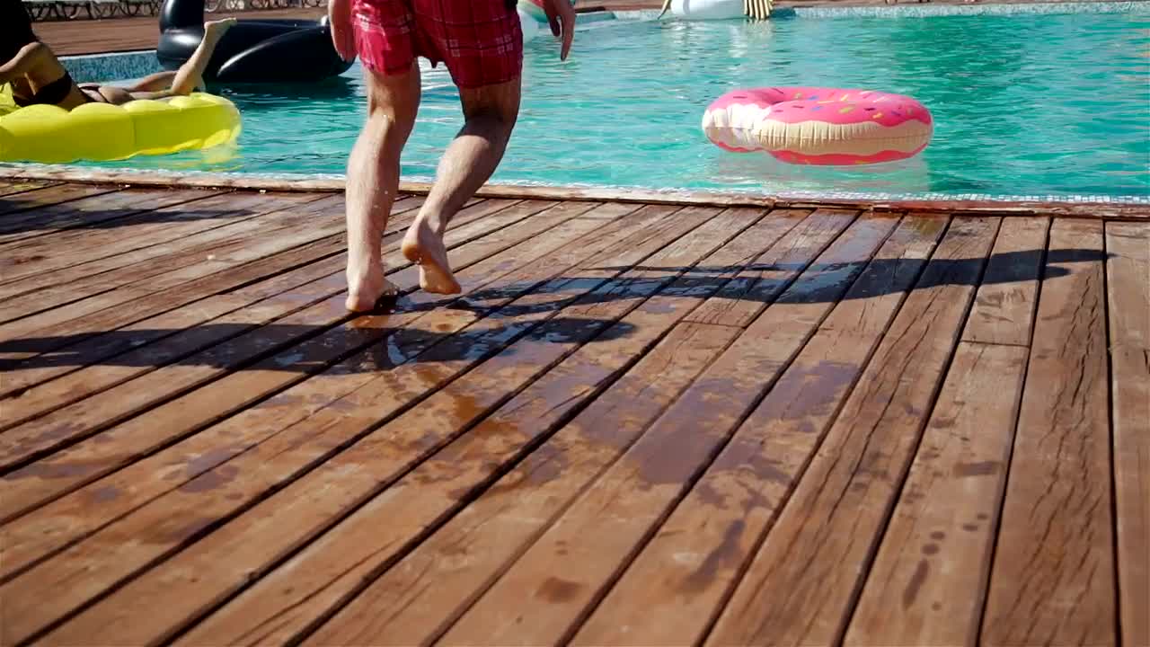 Stock Video Man Jumps In Center Of Donut Float In Poo Animated Wallpaper