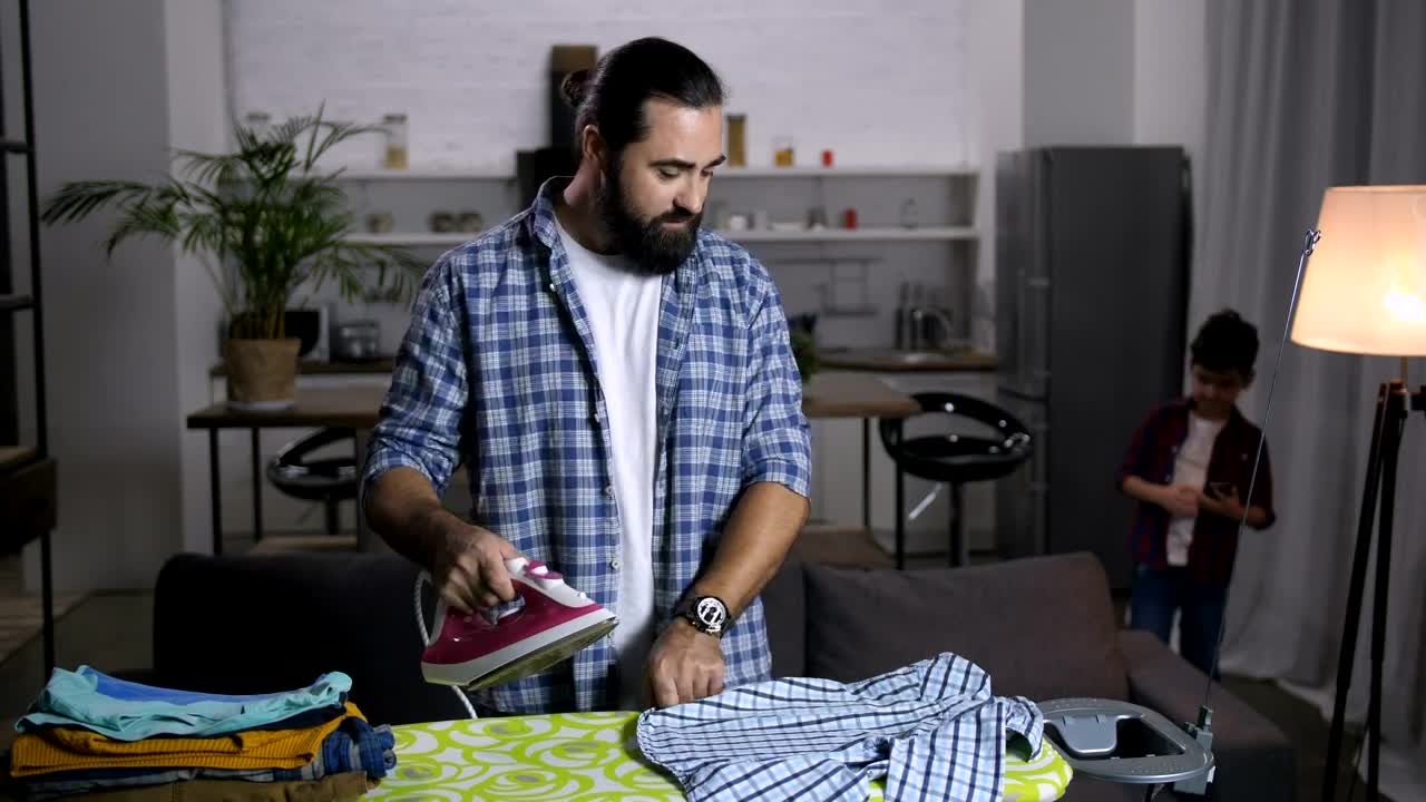 Stock Video Man Ironing His Clothe Animated Wallpaper