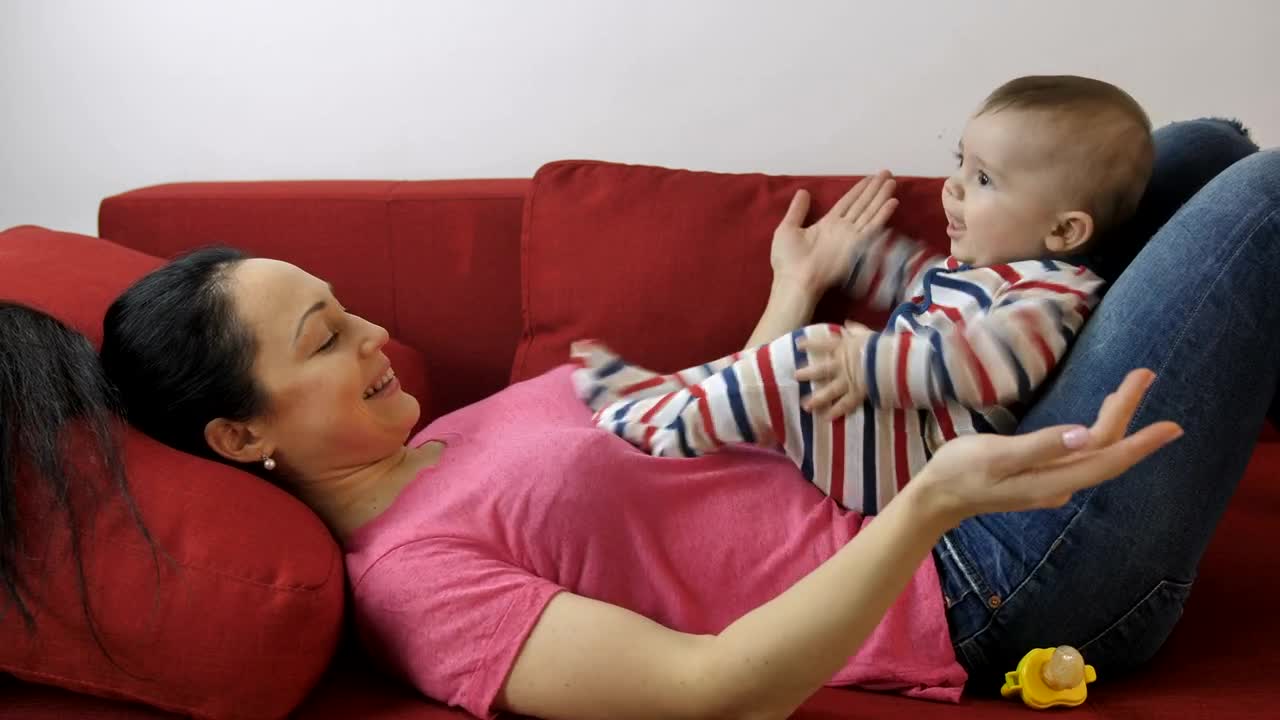 Stock Video Mother With Her Excited Baby Live Wallpaper
