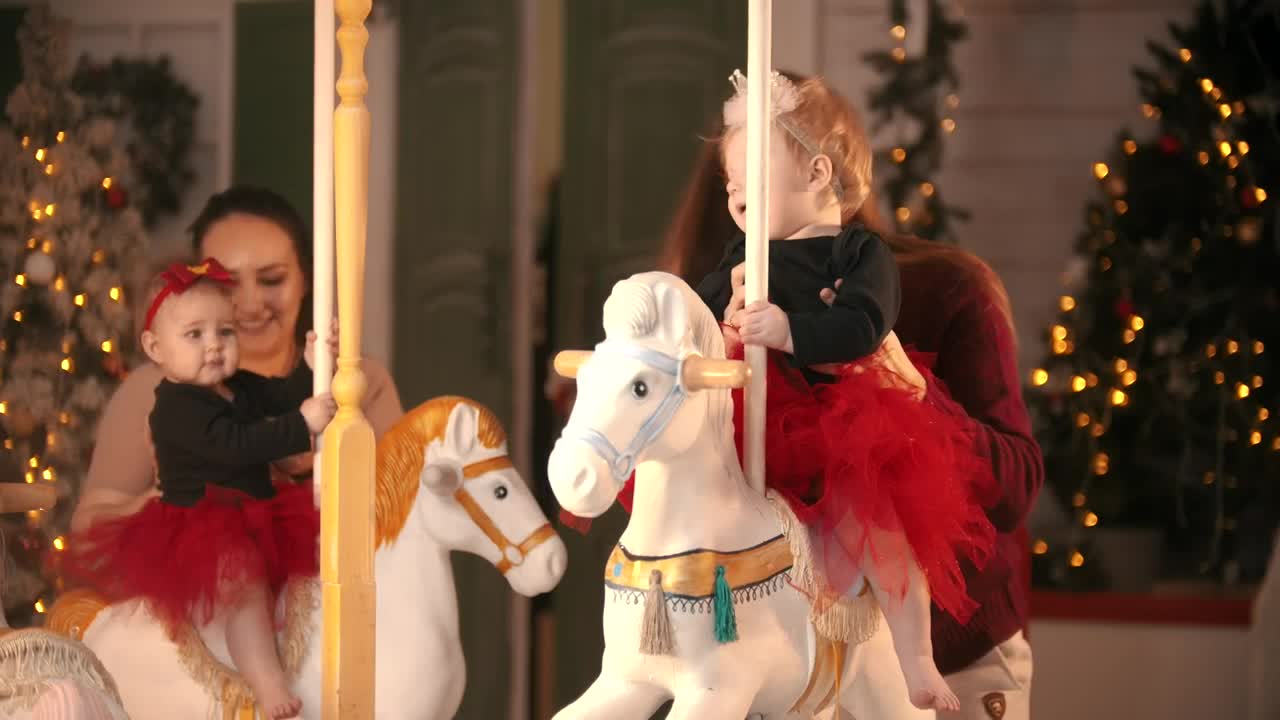 Stock Video Mothers Putting Their Babies On A Carousel Live Wallpaper