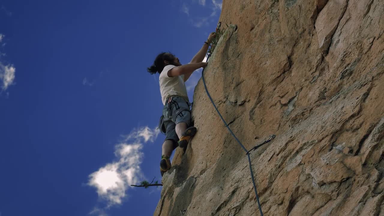 Stock Video Mountaineer Climbing On Top Of A Mountain Live Wallpaper