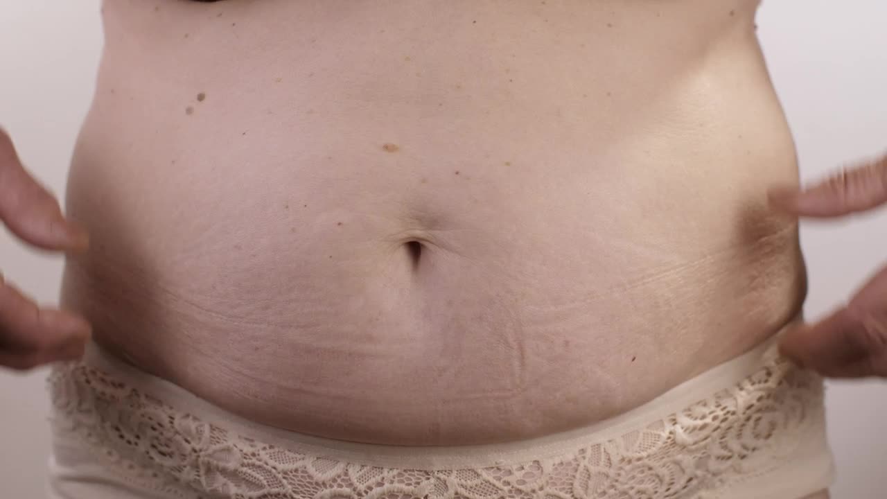 Stock Video Obese Person Touching His Stomach Live Wallpaper