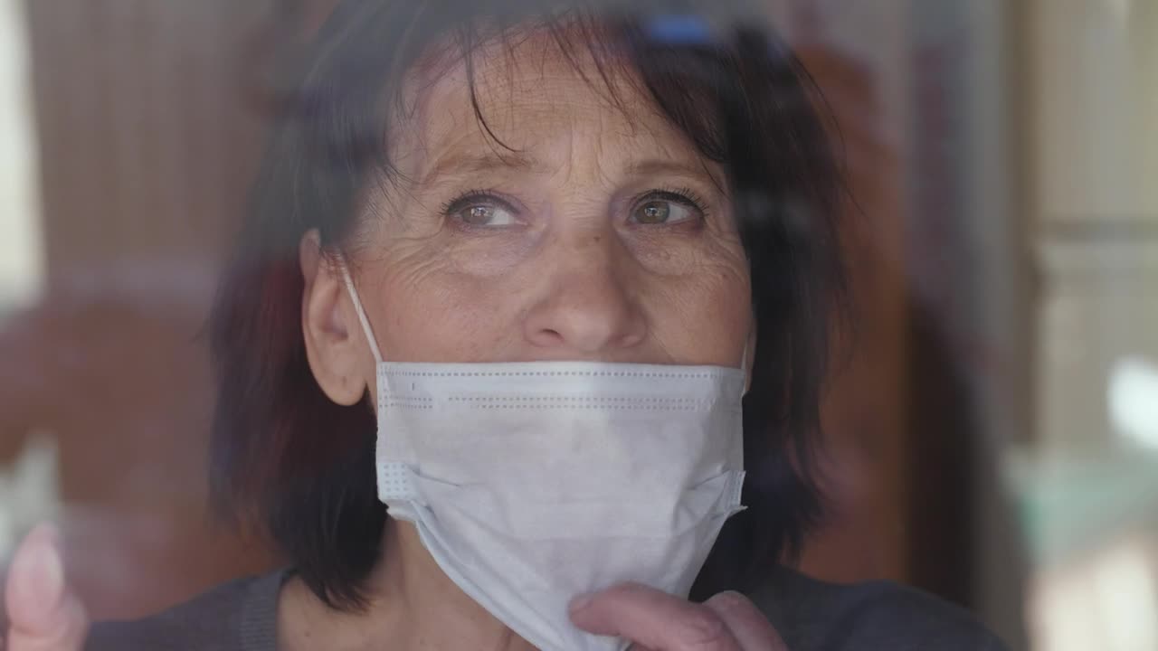 Stock Video Old Woman Takes Off Her Mask Live Wallpaper