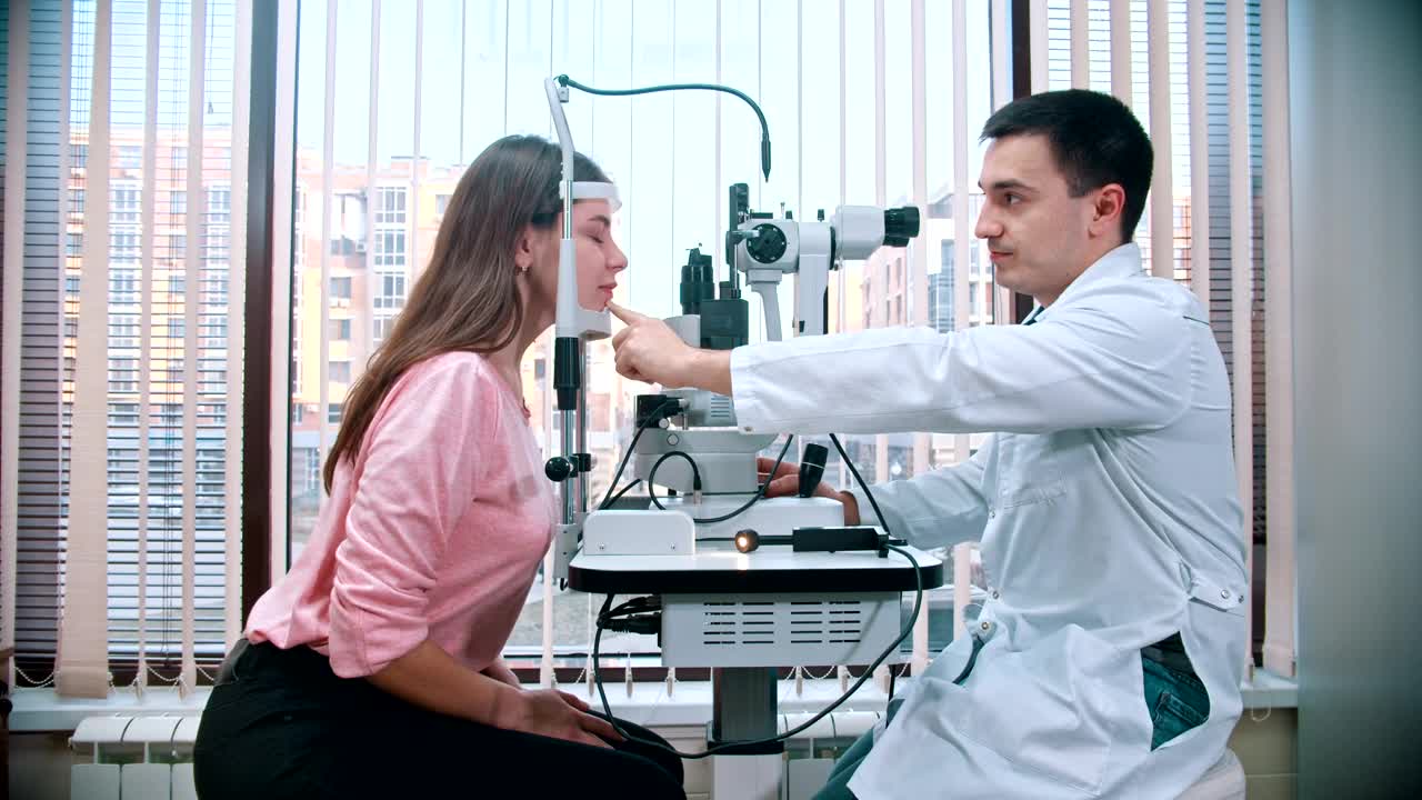 Stock Video Ophthalmologist And A Patient During An Eyesight Test Live Wallpaper