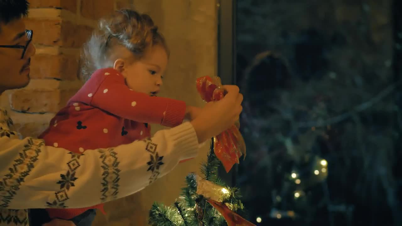 Stock Video Parents And Daughter Putting A Bow On The Top Of Live Wallpaper